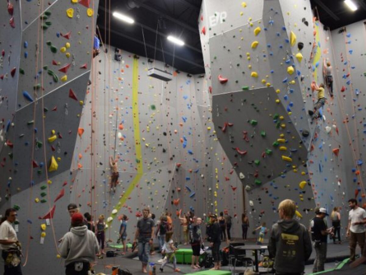 Climbers on colorful indoor rock climbing walls