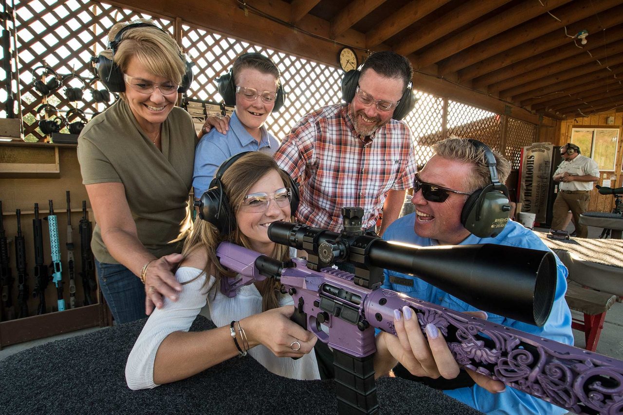 Family enjoying a supervised gun shooting experience at a Jackson Hole range